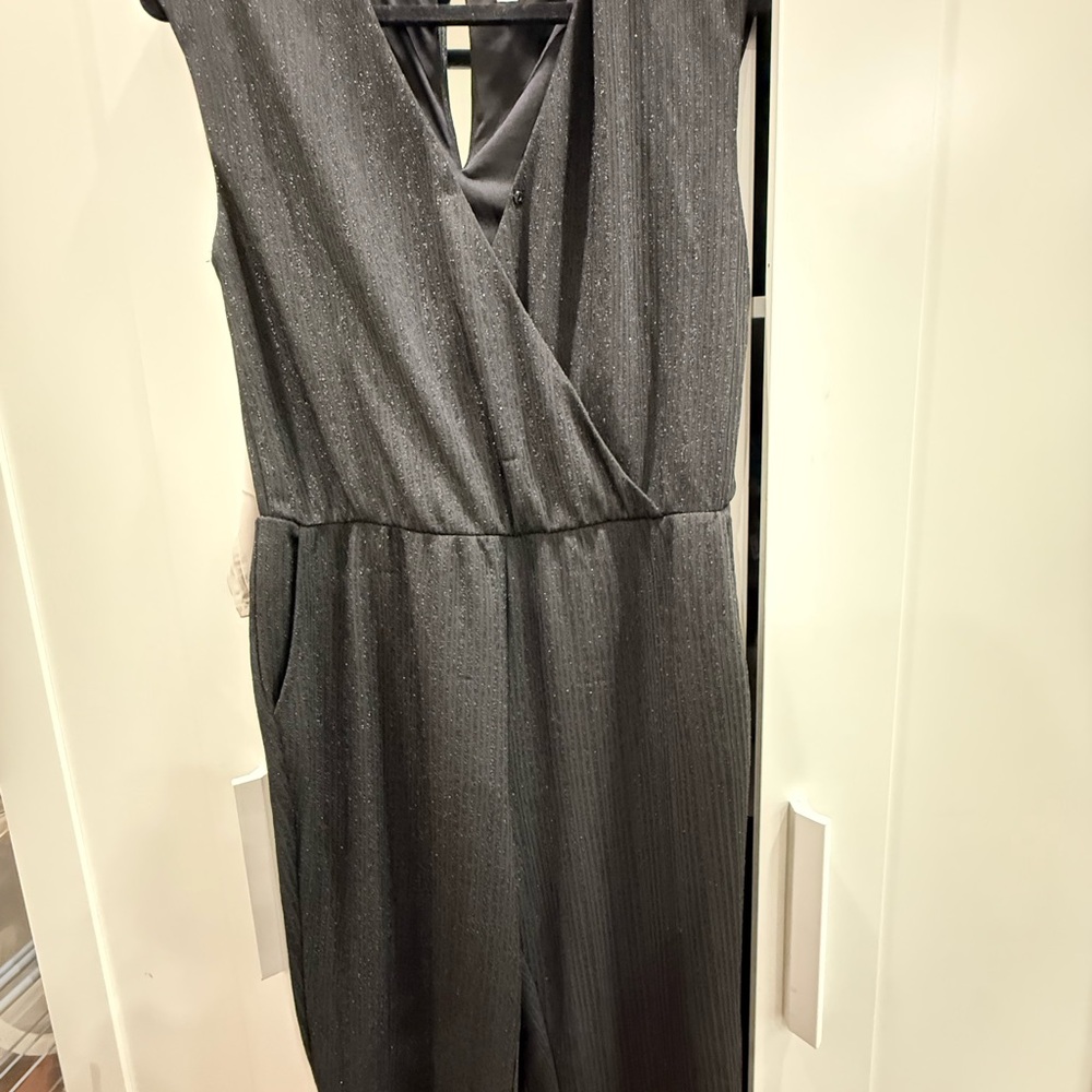 Black glitter  sleeveless jumpsuit.